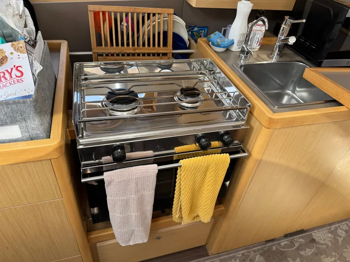 Gayle Force Yacht Photos Pics Galley kitchen in 2014 Beneteau Oceanis 38 yacht with stove and sink.