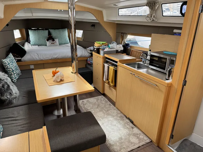 Gayle Force Yacht Photos Pics Luxurious interior of 2014 Beneteau Oceanis 38 yacht with cozy seating and modern kitchen.
