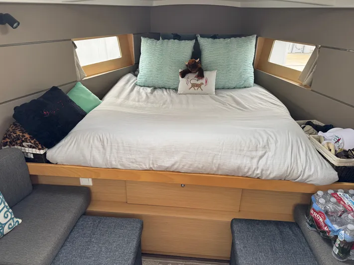 Gayle Force Yacht Photos Pics Cozy cabin interior of 2014 Beneteau Oceanis 38 with plush bedding and seating.