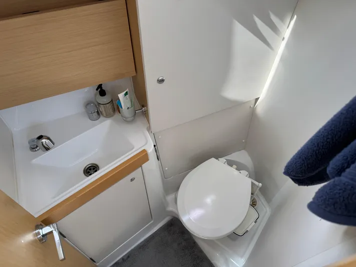 Gayle Force Yacht Photos Pics Beneteau Oceanis 38 bathroom with sink, toilet, and toiletries, 2014 model.