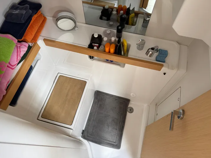 Gayle Force Yacht Photos Pics Bathroom interior of 2014 Beneteau Oceanis 38 yacht with toiletries and towels.