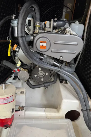 Gayle Force Yacht Photos Pics Engine compartment of a 2014 Beneteau Oceanis 38 sailboat, showcasing mechanical components.