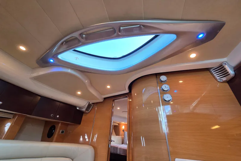 Nina & Alexander Yacht Photos Pics Luxurious interior of 2007 Cranchi Mediterranee 47 HT yacht with skylight and modern design.