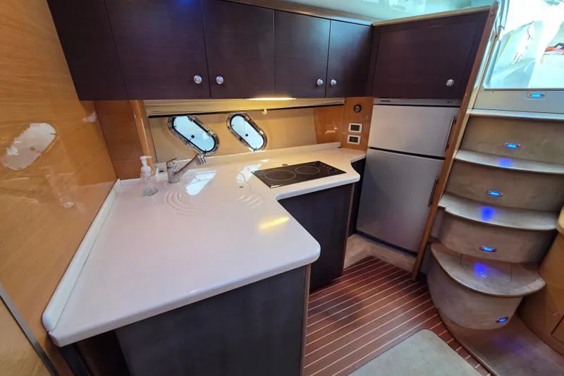 Nina & Alexander Yacht Photos Pics 2007 Cranchi Mediterranee 47 HT yacht kitchen with modern appliances and sleek design.