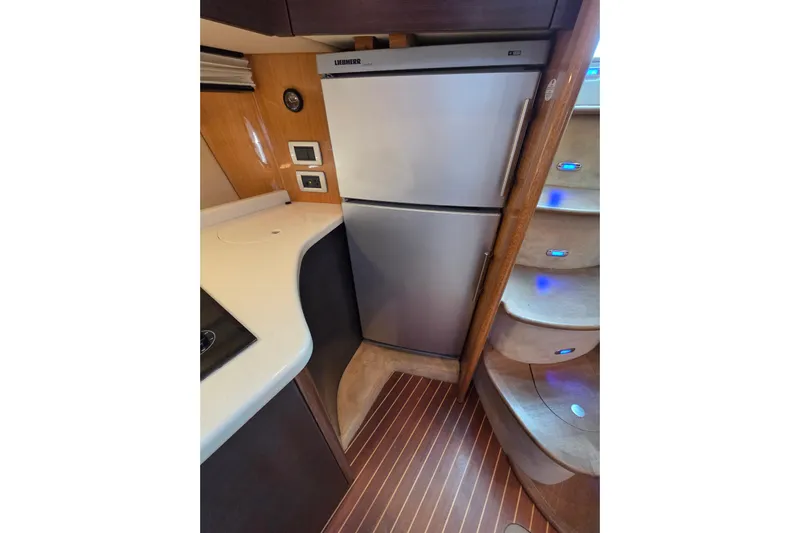 Nina & Alexander Yacht Photos Pics 2007 Cranchi Mediterranee 47 HT yacht interior with modern kitchen and staircase.