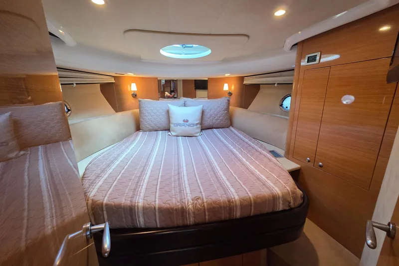 Nina & Alexander Yacht Photos Pics Luxurious cabin interior of 2007 Cranchi Mediterranee 47 HT yacht with cozy bedding.