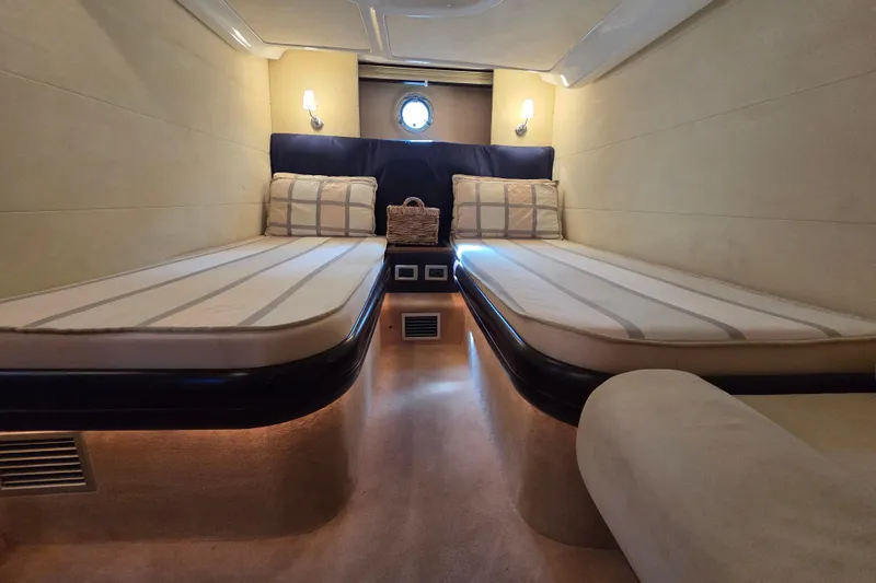 Nina & Alexander Yacht Photos Pics Luxurious cabin interior of 2007 Cranchi Mediterranee 47 HT yacht with twin beds.