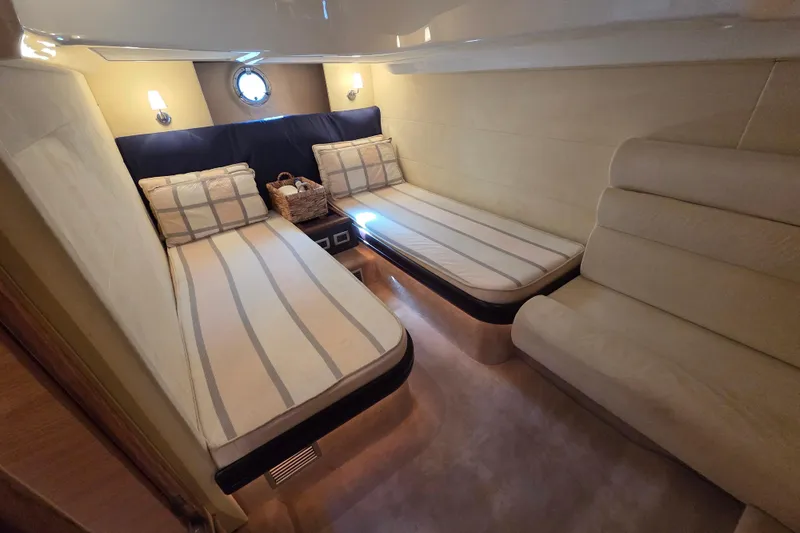 Nina & Alexander Yacht Photos Pics Luxurious cabin interior of 2007 Cranchi Mediterranee 47 HT yacht with twin beds.