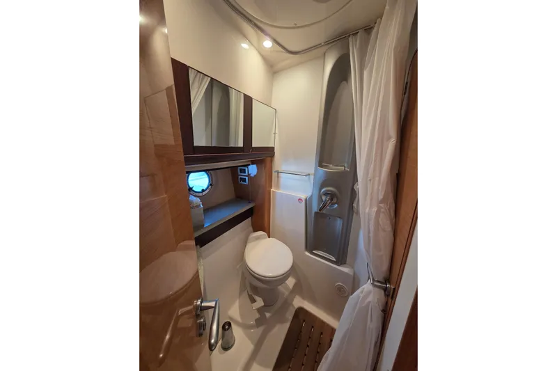 Nina & Alexander Yacht Photos Pics Luxurious bathroom in 2007 Cranchi Mediterranee 47 HT yacht, featuring modern fixtures and elegant design.