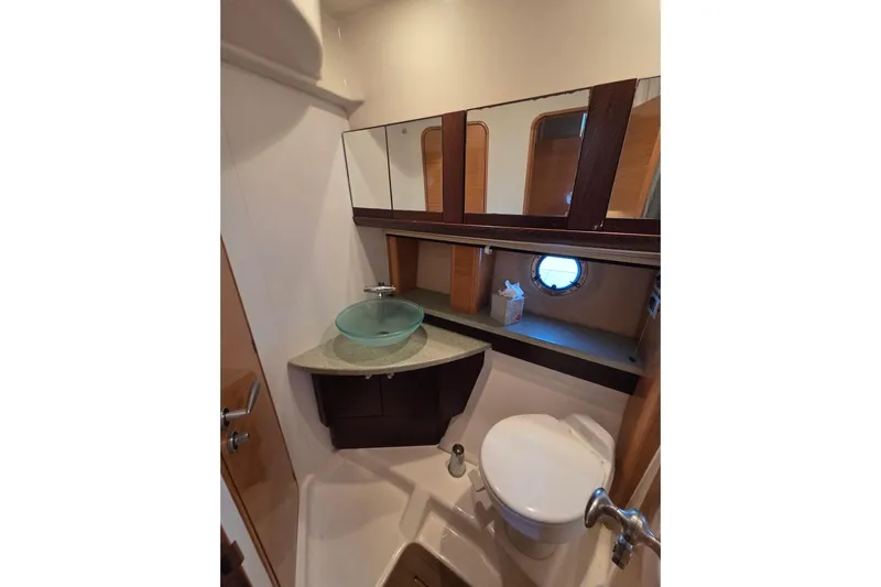 Nina & Alexander Yacht Photos Pics Luxurious bathroom in 2007 Cranchi Mediterranee 47 HT yacht with modern fixtures.