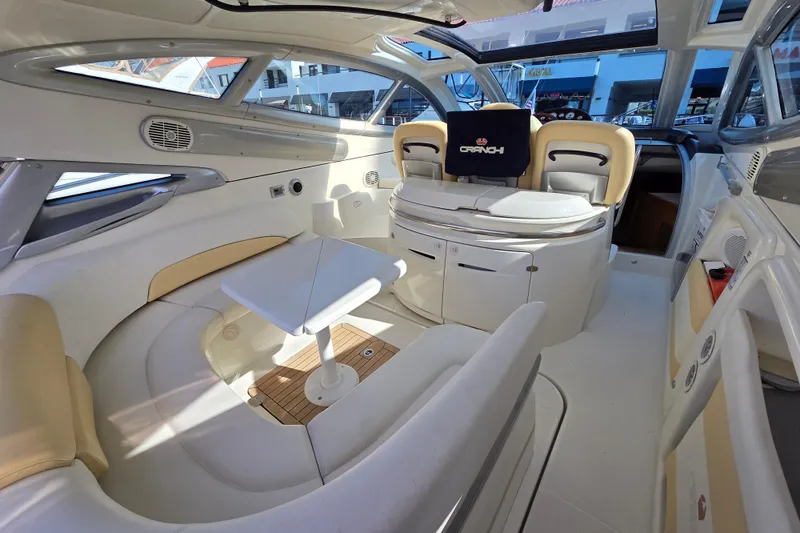 Nina & Alexander Yacht Photos Pics Luxurious interior of 2007 Cranchi Mediterranee 47 HT yacht with elegant seating and table.