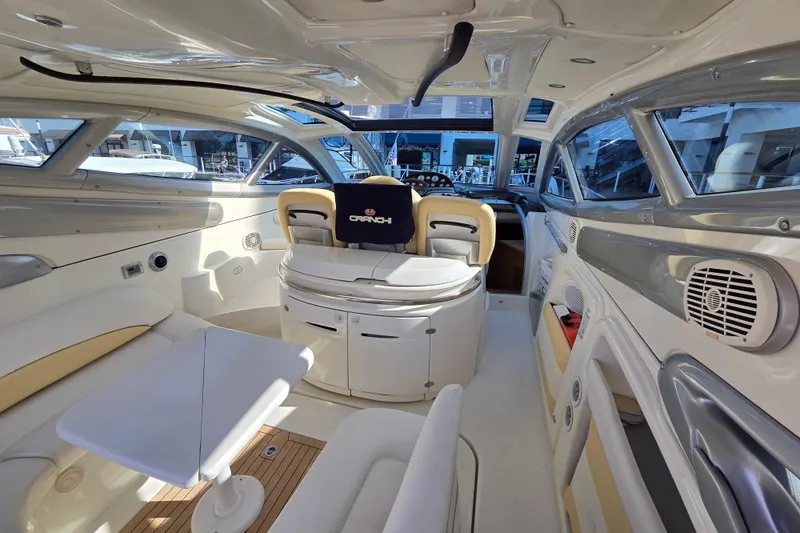 Nina & Alexander Yacht Photos Pics Luxurious interior of 2007 Cranchi Mediterranee 47 HT yacht with modern seating and sleek design.