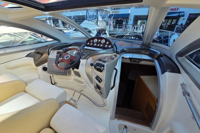 Nina & Alexander Yacht Photos Pics 2007 Cranchi Mediterranee 47 HT yacht helm with modern controls and luxurious seating.