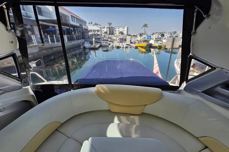 Nina & Alexander Yacht Photos Pics Interior view of 2007 Cranchi Mediterranee 47 HT yacht in a marina setting.