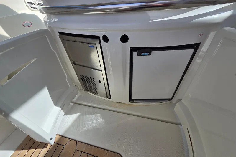 Nina & Alexander Yacht Photos Pics 2007 Cranchi Mediterranee 47 HT yacht interior with built-in refrigerator and storage.