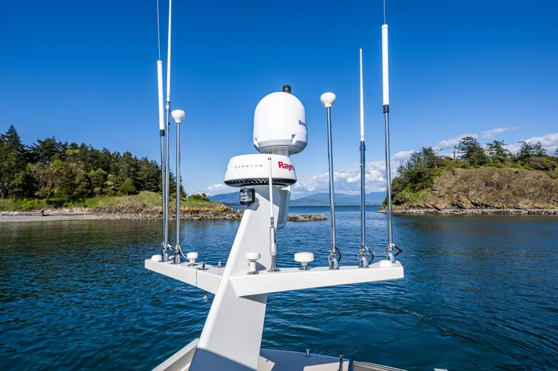 Consequence Free Yacht Photos Pics Coastal Craft 400 IPS 2009 yacht with radar equipment, cruising in scenic coastal waters.