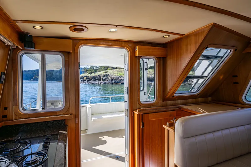 Consequence Free Yacht Photos Pics Interior view of 2009 Coastal Craft 400 IPS yacht with scenic ocean backdrop.