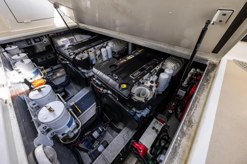 Consequence Free Yacht Photos Pics Engine room of 2009 Coastal Craft 400 IPS, showcasing dual engines and mechanical components.