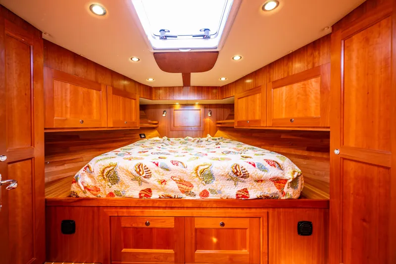 Consequence Free Yacht Photos Pics Luxurious wooden cabin interior of 2009 Coastal Craft 400 IPS yacht with cozy bed and skylight.