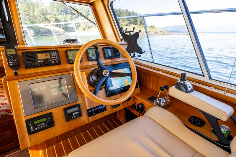 Consequence Free Yacht Photos Pics Interior of 2009 Coastal Craft 400 IPS yacht with navigation equipment and scenic ocean view.