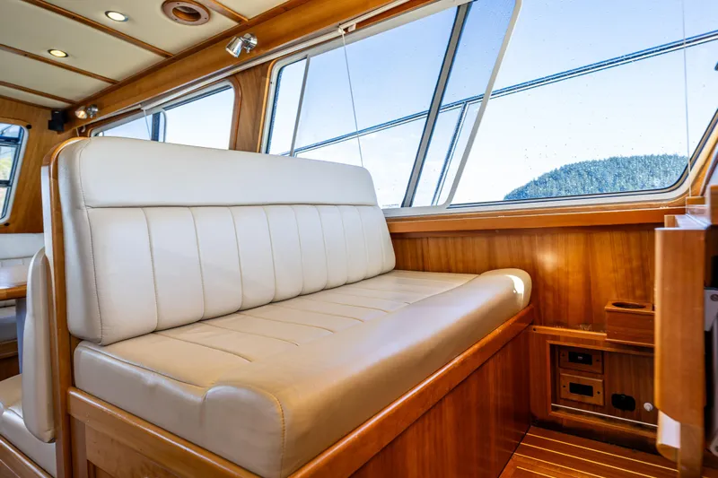 Consequence Free Yacht Photos Pics Interior of 2009 Coastal Craft 400 IPS yacht with leather seating and wooden accents.