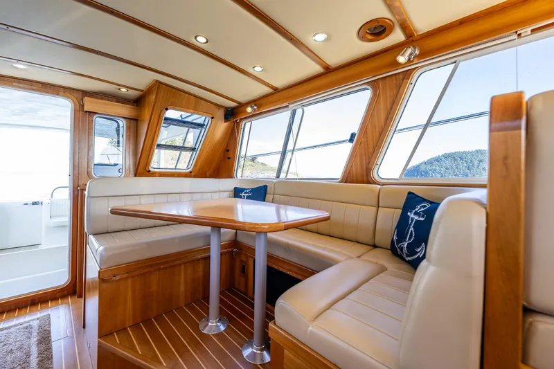 Consequence Free Yacht Photos Pics Luxurious 2009 Coastal Craft 400 IPS yacht interior with elegant wood finish and plush seating.