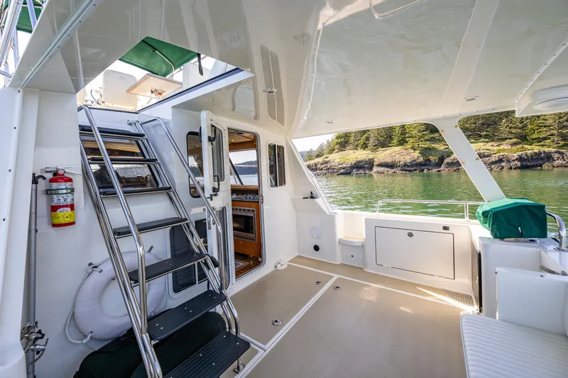 Consequence Free Yacht Photos Pics 2009 Coastal Craft 400 IPS yacht interior with stairs, scenic water view, and modern design.