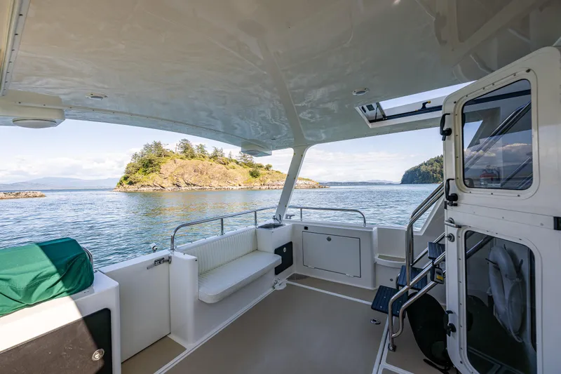 Consequence Free Yacht Photos Pics 2009 Coastal Craft 400 IPS boat interior with scenic island view.