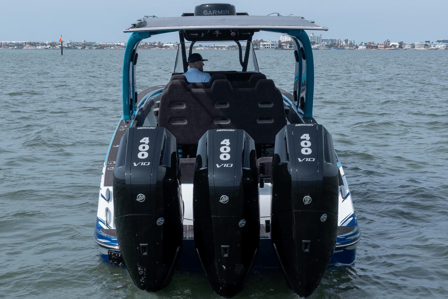 2024 Statement 38 Open boat with triple Mercury 400 V10 engines on water.