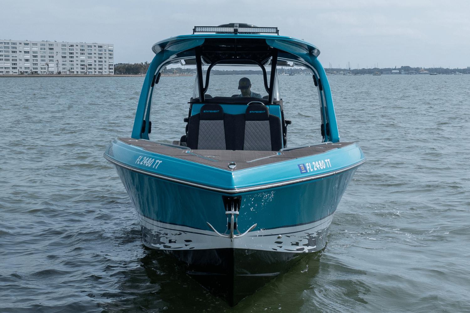 2024 Statement 38 Open boat on water, front view, with modern design and blue exterior.