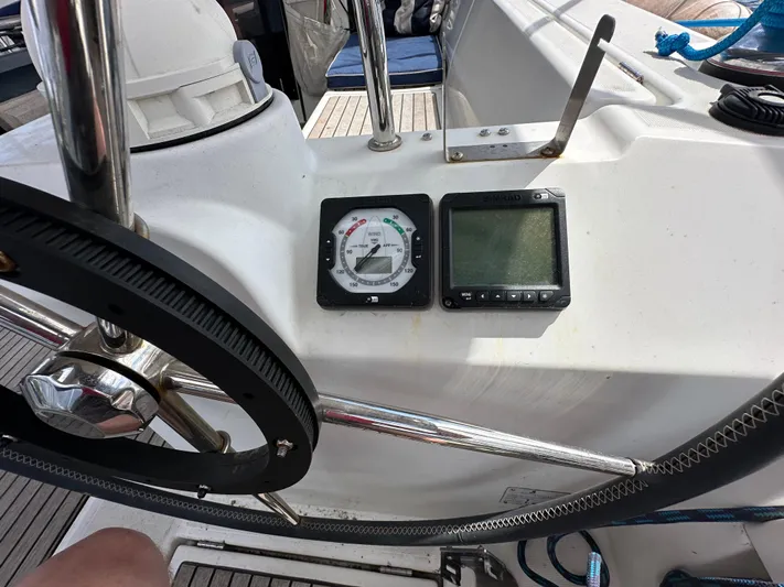 Traveller Two Yacht Photos Pics Cockpit of 2012 Beneteau Oceanis 45 sailboat with navigation instruments and steering wheel.