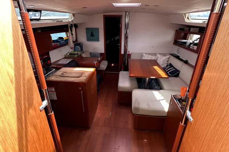 Traveller Two Yacht Photos Pics Interior of 2012 Beneteau Oceanis 45 yacht with cozy seating and wooden finishes.