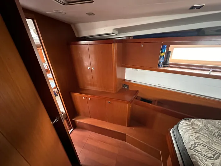 Traveller Two Yacht Photos Pics Interior of 2012 Beneteau Oceanis 45 yacht with wooden cabinetry and window.