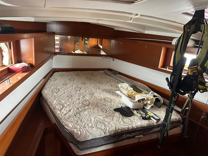 Traveller Two Yacht Photos Pics Cozy cabin interior of 2012 Beneteau Oceanis 45 sailboat with bed and storage.