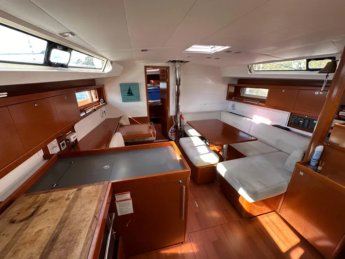 Traveller Two Yacht Photos Pics Interior of 2012 Beneteau Oceanis 45 yacht with modern wood finish and spacious seating area.