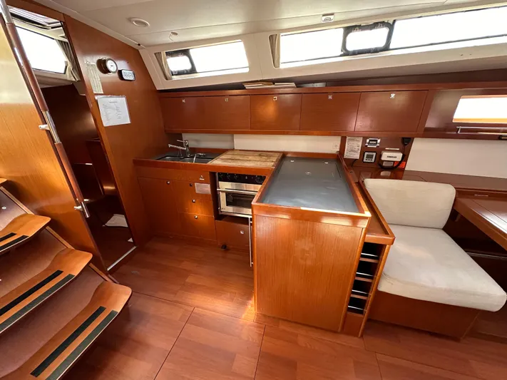 Traveller Two Yacht Photos Pics Interior of 2012 Beneteau Oceanis 45 yacht, featuring a modern kitchen and seating area.
