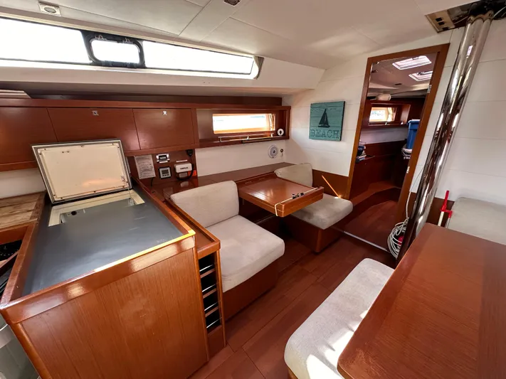 Traveller Two Yacht Photos Pics Interior of 2012 Beneteau Oceanis 45 yacht with modern wood finish and seating area.