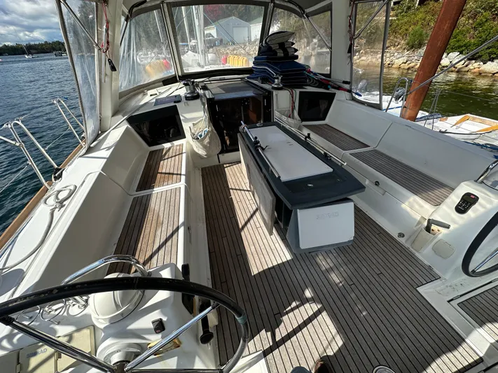 Traveller Two Yacht Photos Pics Cockpit of 2012 Beneteau Oceanis 45 sailboat with spacious seating and steering wheel.
