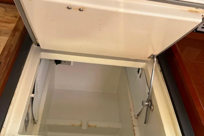 Traveller Two Yacht Photos Pics Open storage compartment on 2012 Beneteau Oceanis 45 yacht, showcasing interior space.