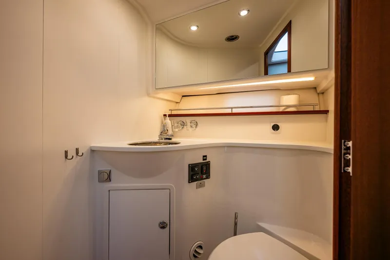 Crazy Love Yacht Photos Pics Luxurious bathroom interior of 2023 Nimbus 405 Coup&eacute; yacht, featuring modern fixtures and lighting.