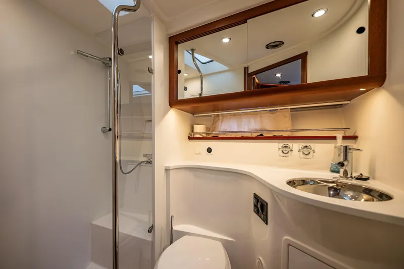 Crazy Love Yacht Photos Pics Luxurious bathroom in 2023 Nimbus 405 Coup&eacute; yacht with modern fixtures and elegant design.