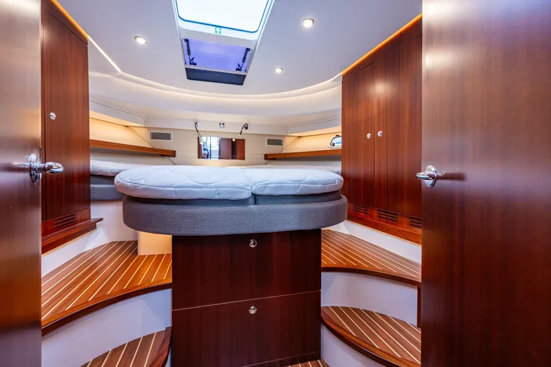 Crazy Love Yacht Photos Pics Luxurious interior of 2023 Nimbus 405 Coup&eacute; yacht with elegant wood finishes.