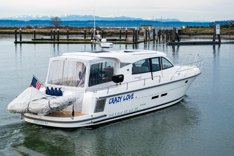 Crazy Love Yacht Photos Pics 2023 Nimbus 405 Coup&eacute; yacht named "Crazy Love" cruising in a scenic harbor.