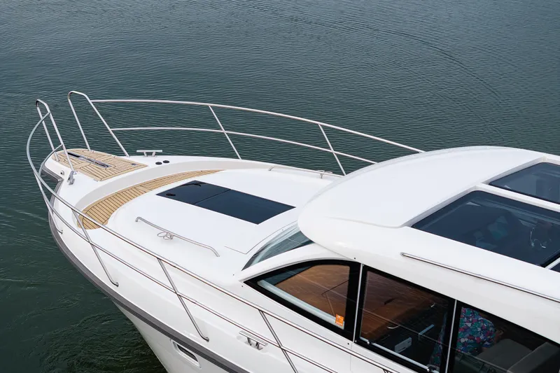 Crazy Love Yacht Photos Pics 2023 Nimbus 405 Coup&eacute; yacht on calm water, showcasing sleek design and modern features.