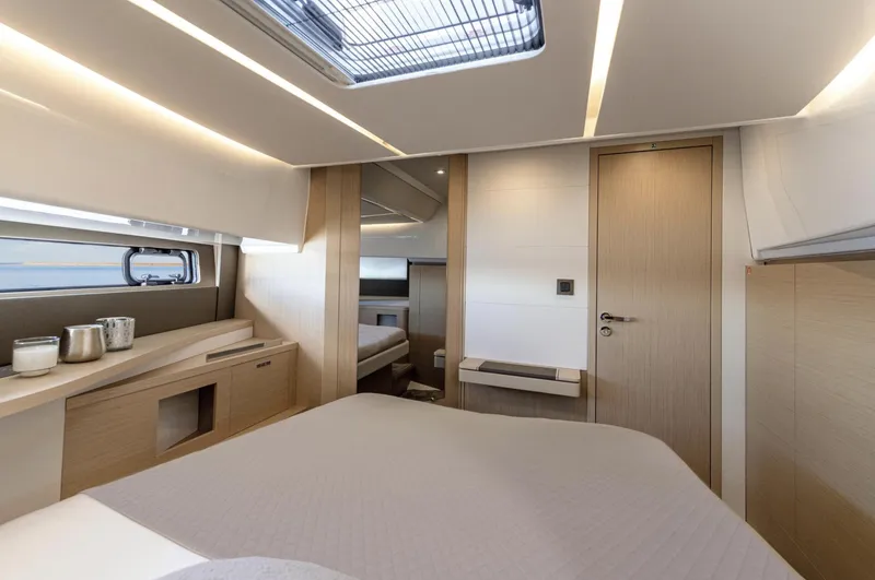  Yacht Photos Pics Luxurious interior of 2025 Jeanneau DB/37 OB yacht cabin with modern design.