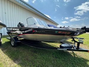 2013 Tracker Pro Guide V-175 WT boat on trailer, parked outdoors.