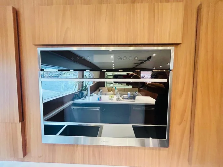  Yacht Photos Pics Modern kitchen interior on a 1988 Bertram 54' yacht with sleek appliances.