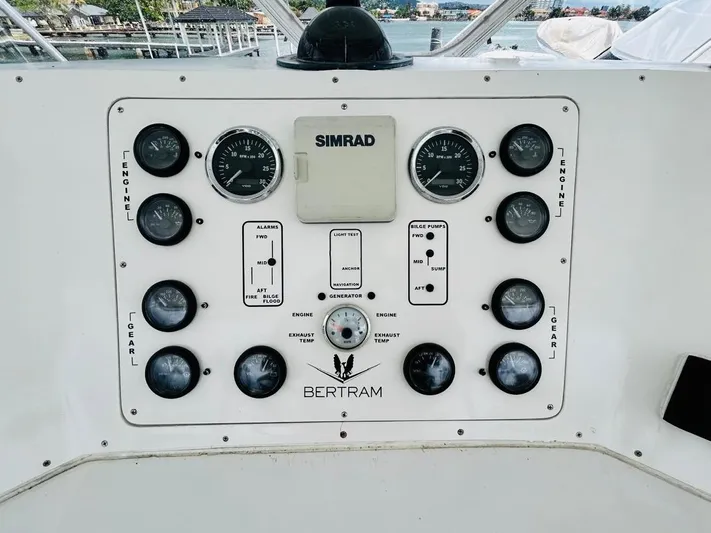  Yacht Photos Pics Control panel of a 1988 Bertram 54' yacht with gauges and Simrad equipment.