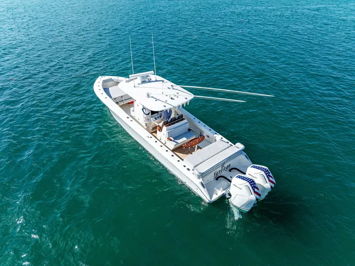 Vantage Yacht Photos Pics 2015 Bahama Center Console boat on clear blue water, aerial view.