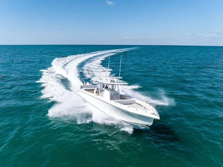Vantage Yacht Photos Pics 2015 Bahama Center Console boat cruising on open ocean waters.